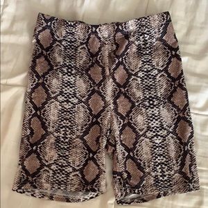 Princess Polly snakeprint biker shorts.